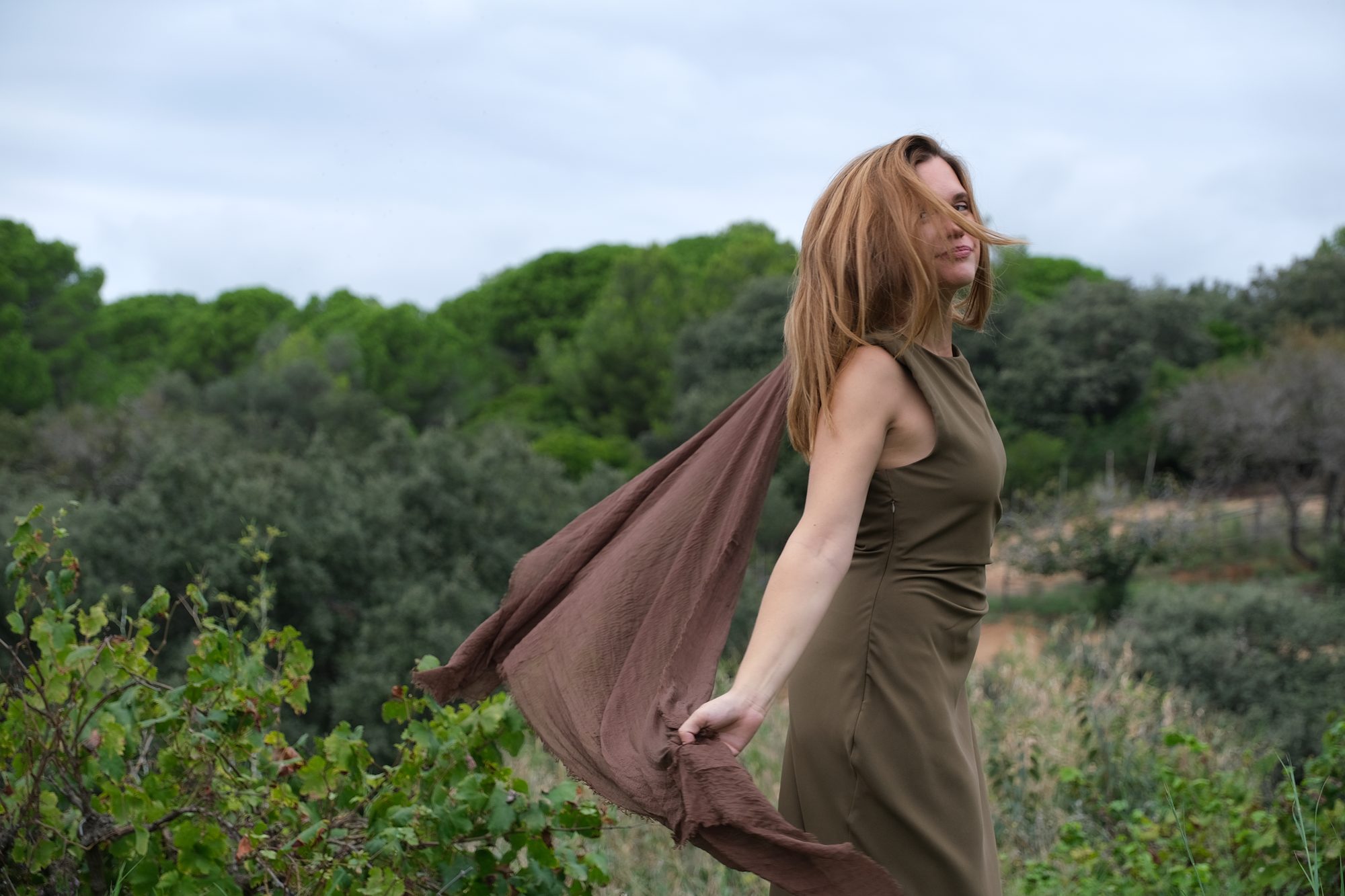Merce walking in an open field