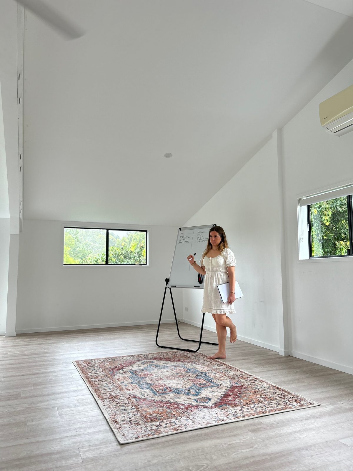 Merce mapping out a business at the whiteboard